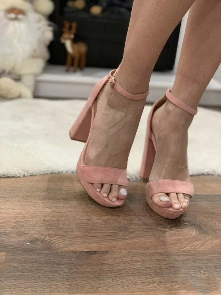 Russian woman toes in pink sandals